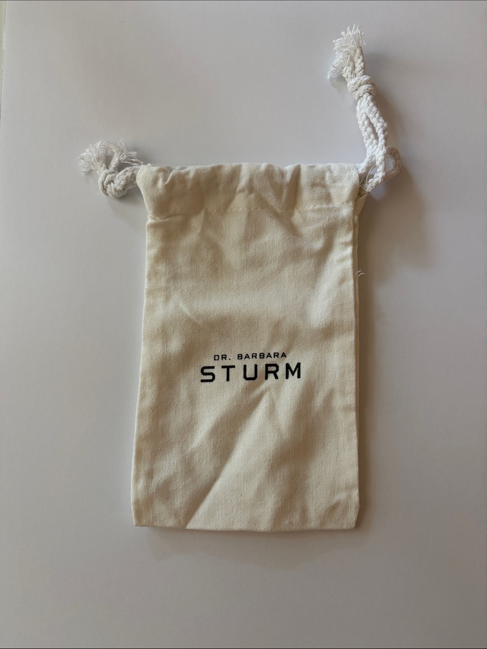 NWOT Dr. Barbara Sturm Cream Canvas Drawstring Bag with Black Logo
